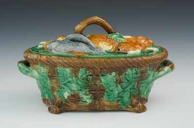 Appraisal: A Majolica Covered Game Tureen Modeled as a lidded basket