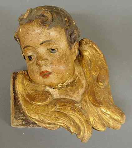 Appraisal: Early Continental carved angel's head with original paint and gilt