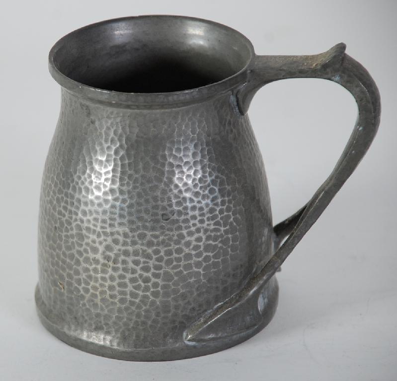 Appraisal: ARTS AND CRAFTS HAMMERED PEWTER PINT TANKARD with bifurcated handle