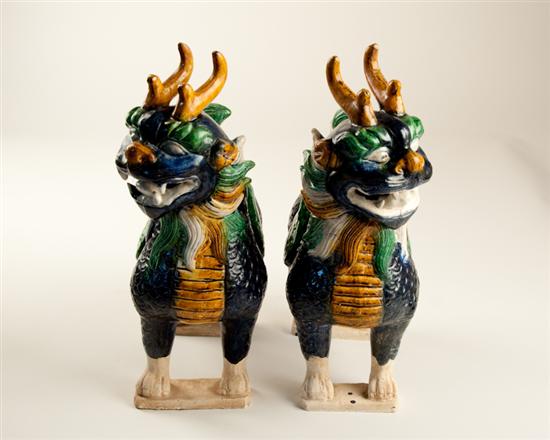 Appraisal: A Pair of Sancai Glazed Qilin with some firing flaws