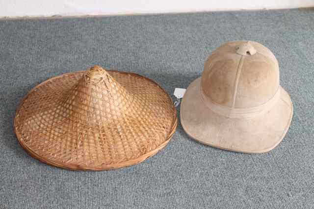 Appraisal: A PITH HELMET and two coolie hats