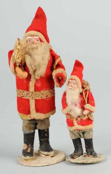 Appraisal: Lot of Cloth-Dressed Santas Description Both with composition faces and