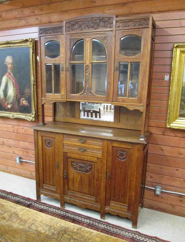 Appraisal: CARVED OAK SIDEBOARD Belgian c in two sections H x