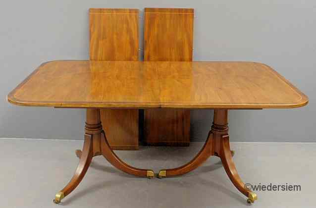 Appraisal: Regency style inlaid mahogany banquet table with two extra leaves