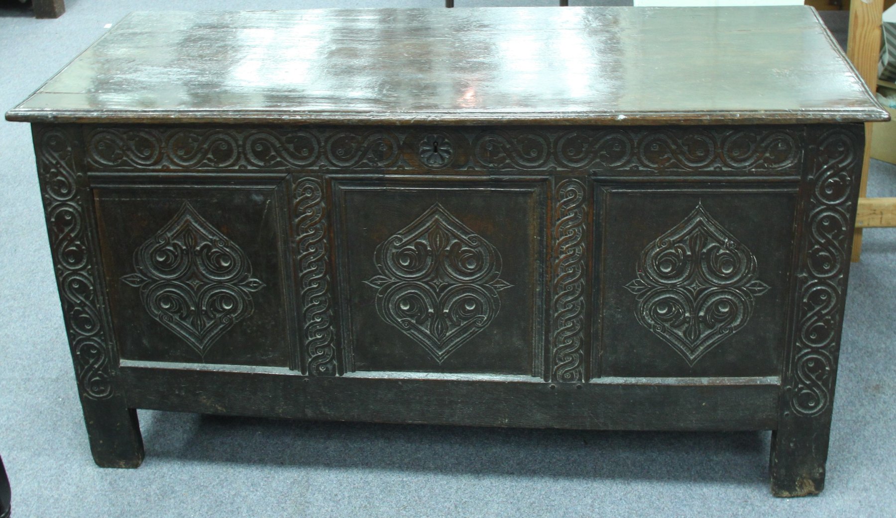 Appraisal: A late th Century oak coffer the plank top above