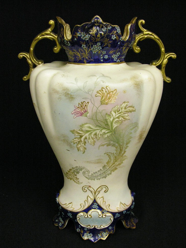 Appraisal: INCH DOUBLE HANDLED PORCELAIN VASE Heavy enamelled with a flower