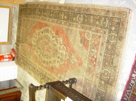 Appraisal: A RUST GROUND CARPET with central medallion and foliate geometric