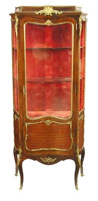 Appraisal: A French rosewood and ormolu mounted vitrine the serpentine glass