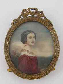 Appraisal: An oval hand painted miniature of a young woman in