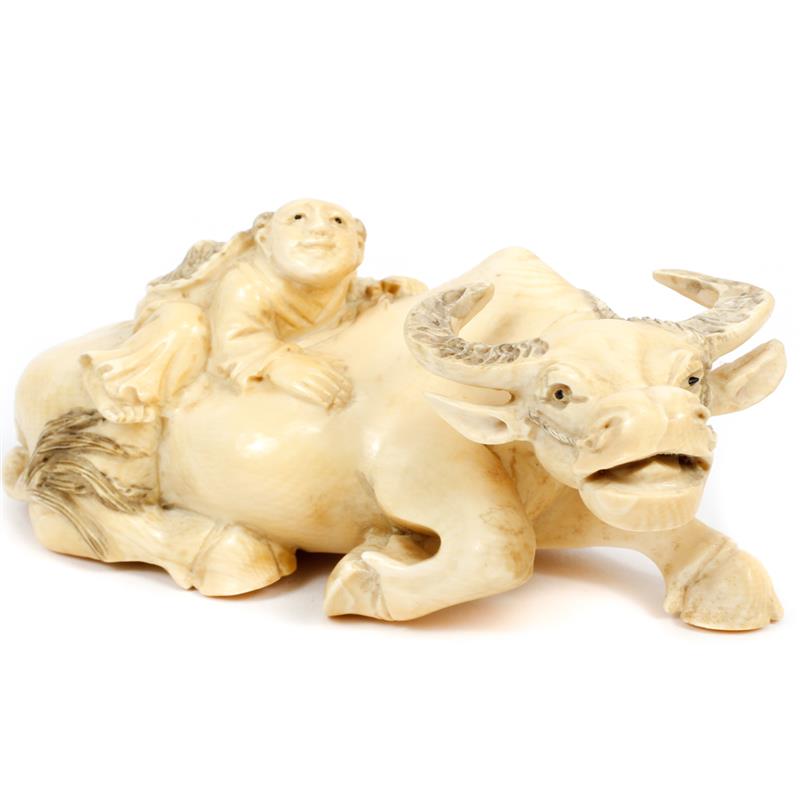 Appraisal: Chinese carved ivory figure group of man riding water buffalo