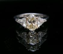 Appraisal: Champagne Diamond Platinum Ring A gorgeous oval cut diamond flanked