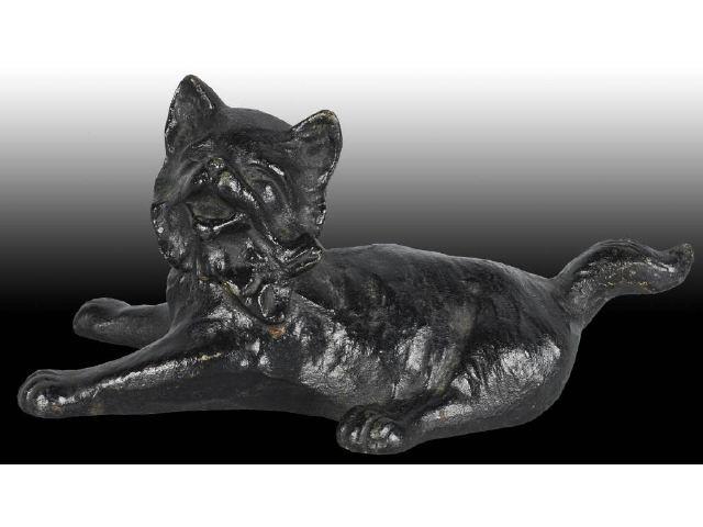 Appraisal: Reclining Kitten with Bow Cast Iron Doorstop Description Full-figure two