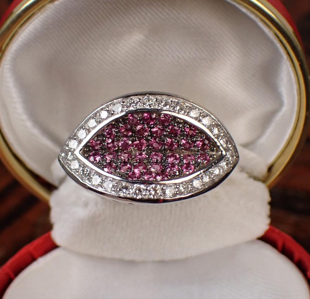 Appraisal: DIAMOND PINK SAPPHIRE AND FOURTEEN KARAT GOLD RING The heavy