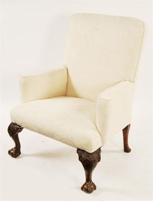 Appraisal: A late th century upholstered easy armchair with scroll arms