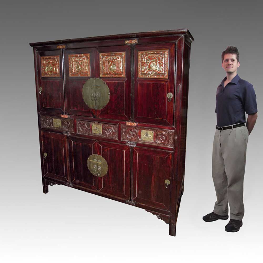 Appraisal: CHINESE EIGHT DOOR CABINET The upper four doors with carved