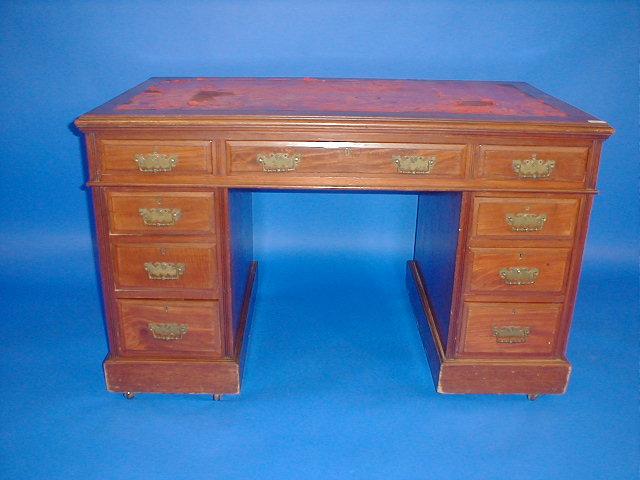 Appraisal: A late Victorian walnut kneehole desk by Edwards and Roberts