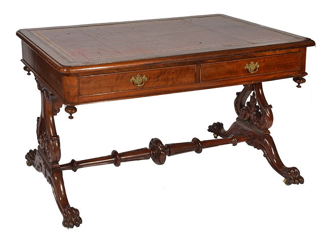 Appraisal: A VICTORIAN MAHOGANY WRITING TABLE with inset leather top fitted