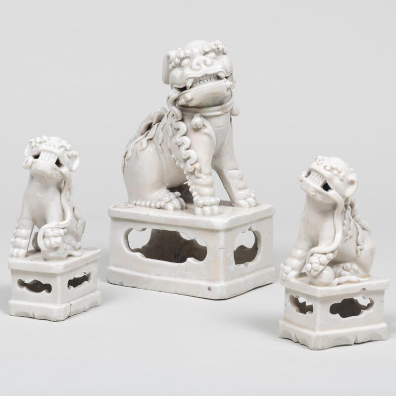 Appraisal: Group of Three Chinese White Glazed Porcelain Buddhistic Lion Joss