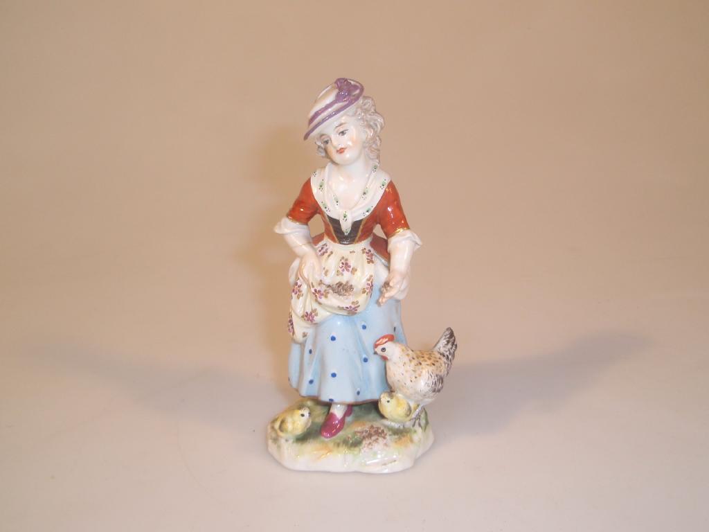 Appraisal: A Ludwigsburg figure of a country girl polychrome painted and