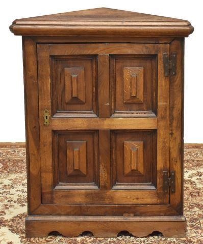 Appraisal: French Provincial oak corner cabinet th c triangular case single