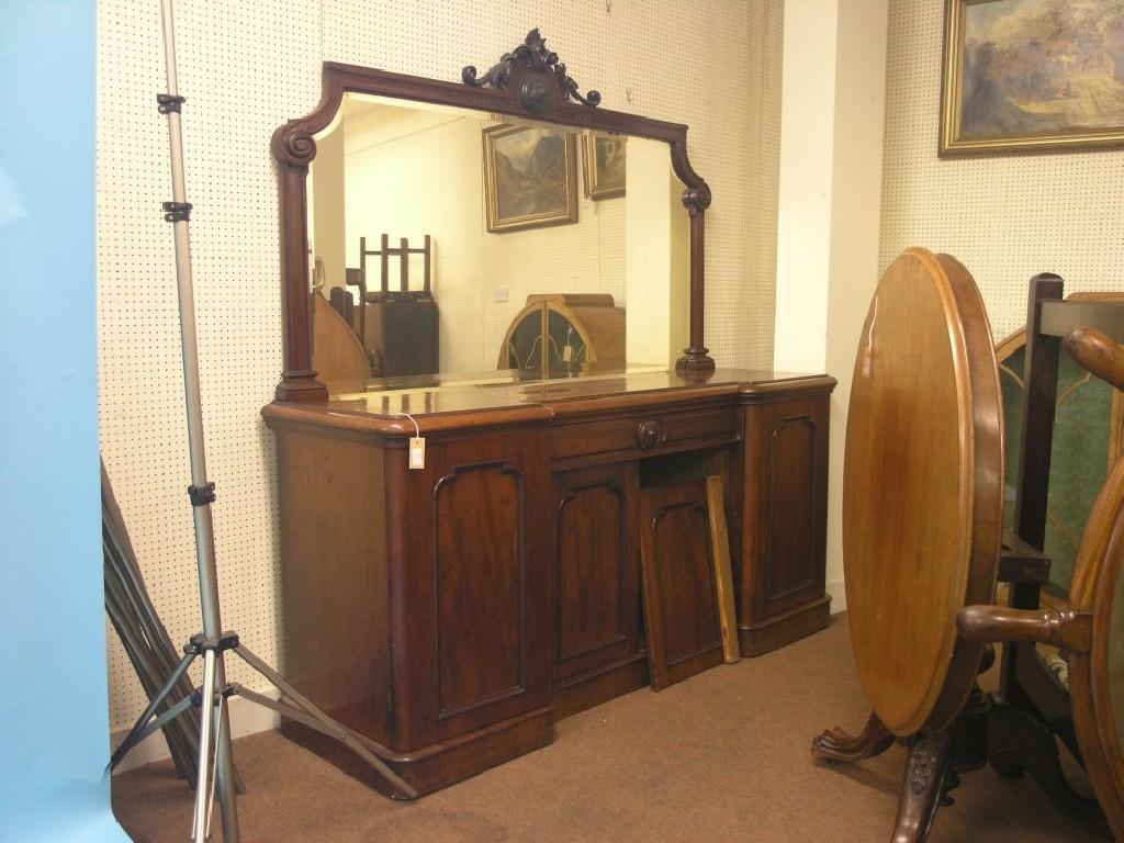 Appraisal: A large Victorian mahogany sideboard raised mirror back with carved