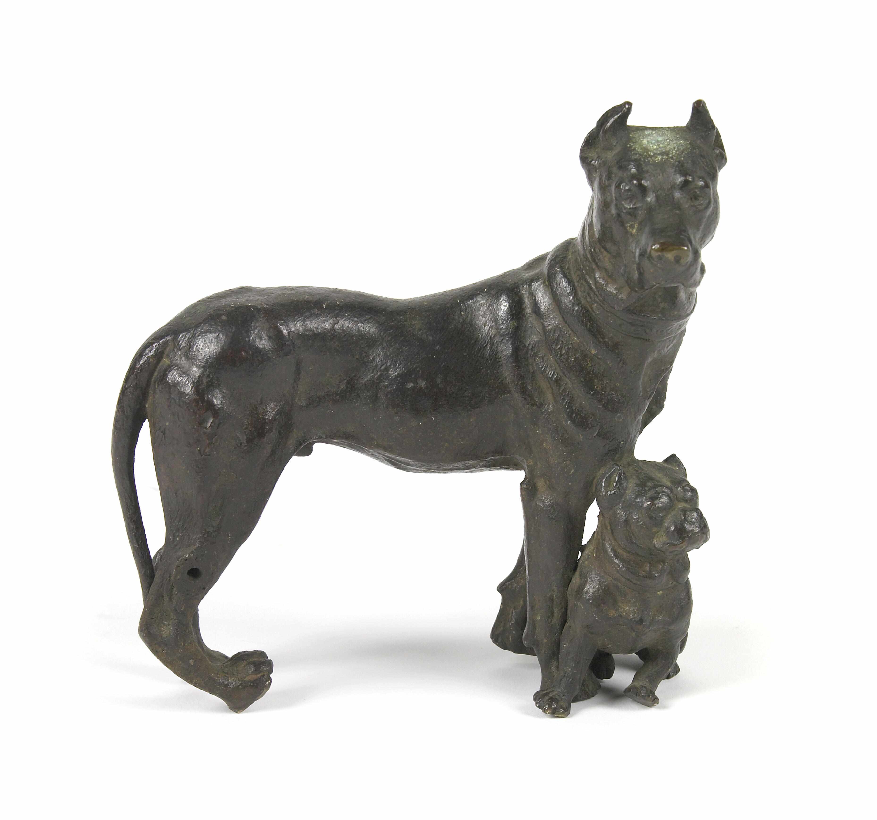 Appraisal: A patinated bronze animalier group Modeled as a large dog