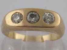 Appraisal: A yellow metal tests carat gold three stone diamond ring