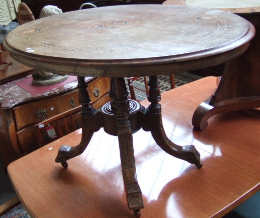 Appraisal: A Victorian walnut marquetry inlaid loo table the oval top