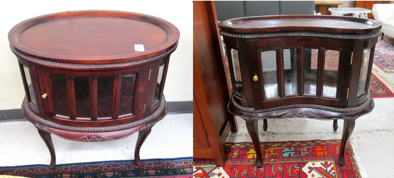 Appraisal: TWO MAHOGANY AND BEVELED GLASS VITRINE TABLES one oval and