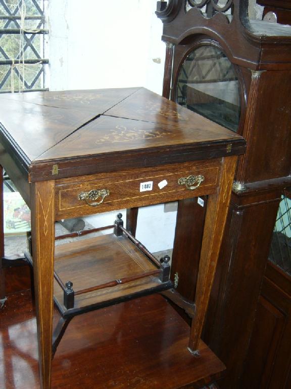 Appraisal: An inlaid Edwardian rosewood envelope card table of usual form