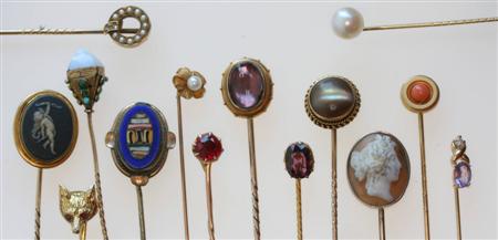 Appraisal: A collection of various gold tie pins including examples with