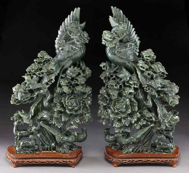 Appraisal: Pr Chinese carved jade phoenix surrounded by carved birds flowers