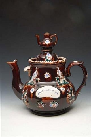 Appraisal: A VICTORIAN BARGEWARE TEA POT the central panel inscribed 'Remember