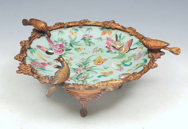 Appraisal: A CHINESE CELADON AND GILT METAL MOUNTED TAZZA decorated three