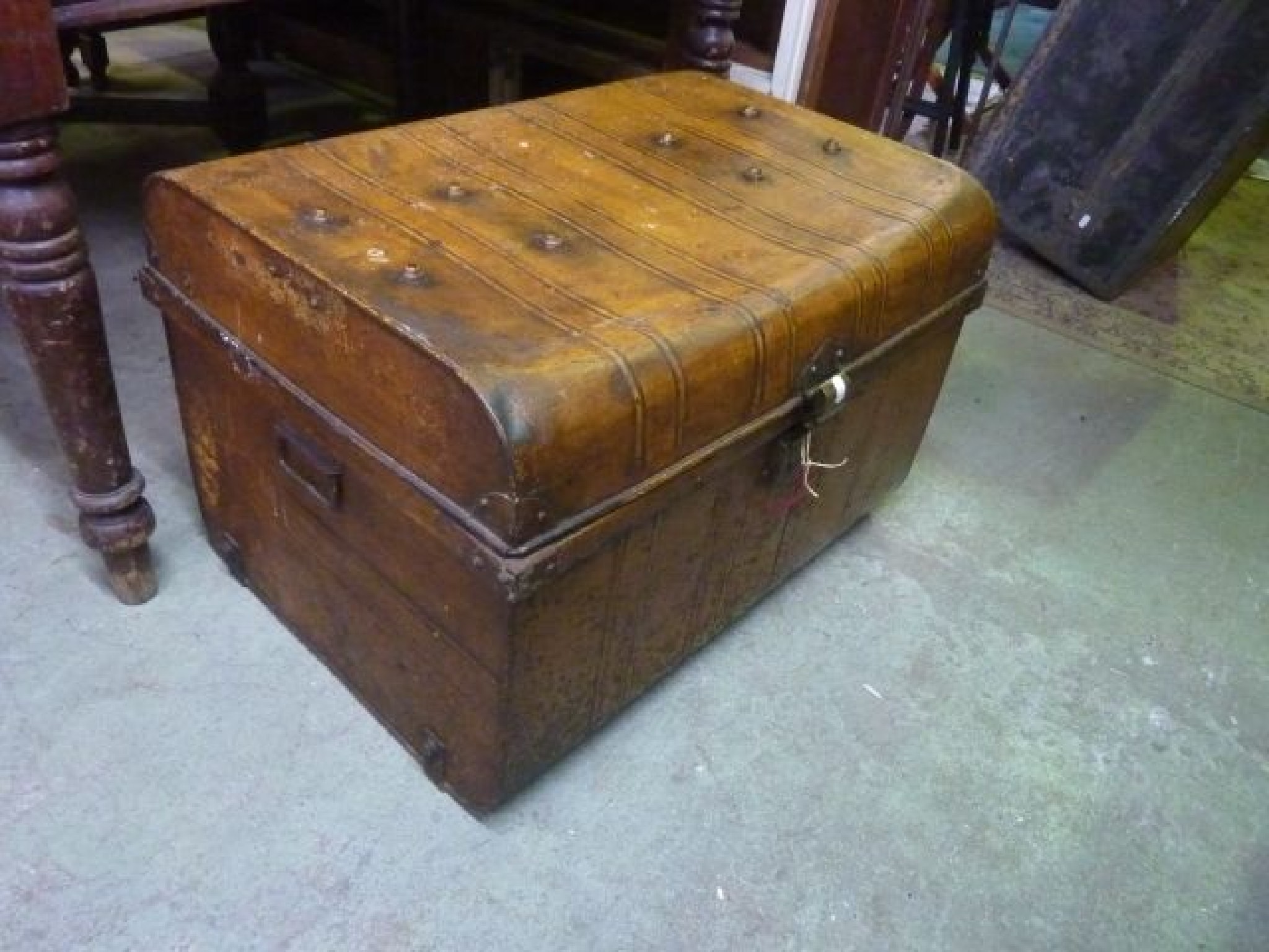 Appraisal: A vintage tin trunk with original simulated timber paintwork