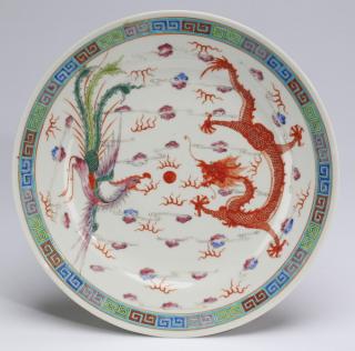 Appraisal: Chinese dragon and phoenix plate w Chinese iron red and