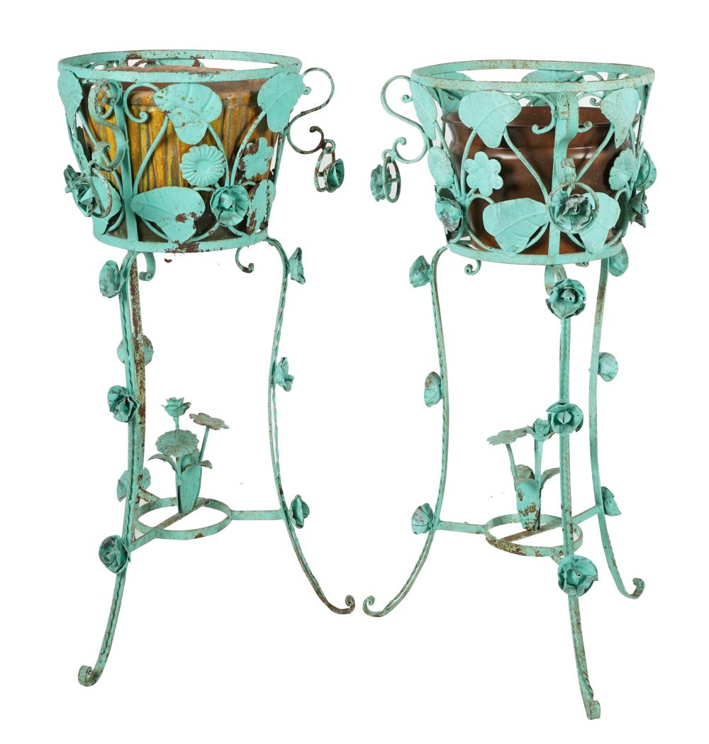 Appraisal: PAIR OF PAINTED IRON PLANTERSeach on three legs the interiors