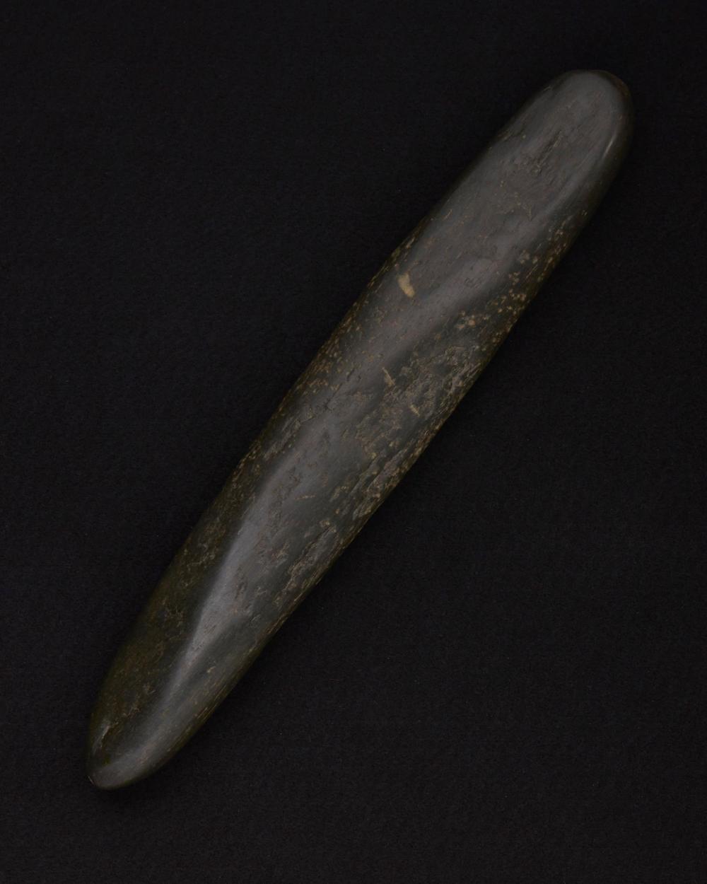 Appraisal: A large carved green stone mano Pre-historic or later In