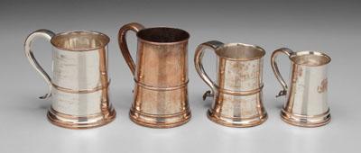 Appraisal: Four Old Sheffield plate tankards tapering sides S scroll handles