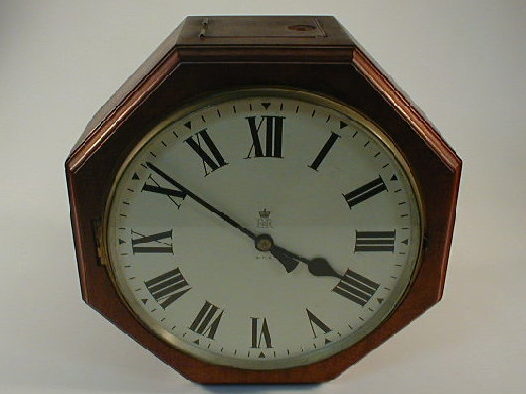 Appraisal: A GPO double faced wall clock with mahogany octagonal case