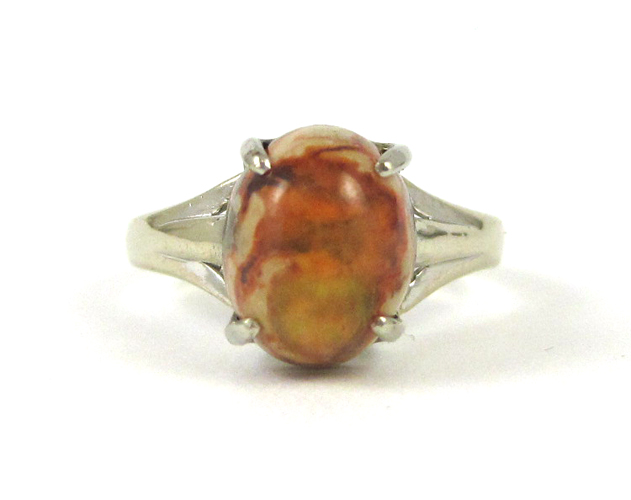 Appraisal: FIRE BOULDER OPAL AND FOURTEEN KARAT GOLD RING The white