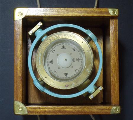 Appraisal: Maritime Interest Two brass marine compasses comprising a painted brass