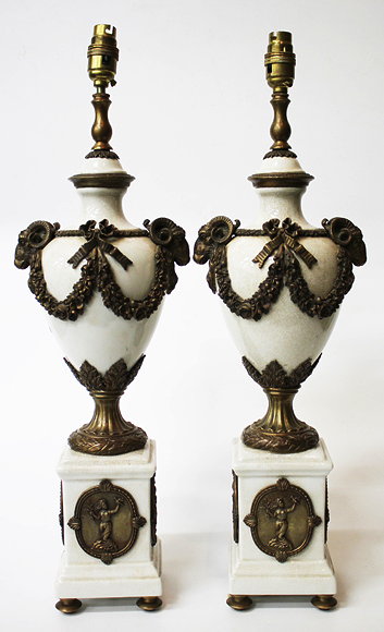 Appraisal: A PAIR OF FRENCH POTTERY TABLE LAMPS with bronzed metal