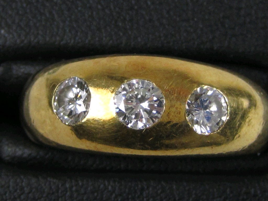 Appraisal: A Gentleman's Diamond three stone Ring the brilliant-cut stones gypsy-set