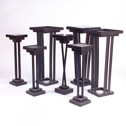 Appraisal: Seven oversized pedestals each a black enameled metal construction with