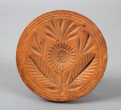 Appraisal: Rare redware butterprint th c with floral decoration dia