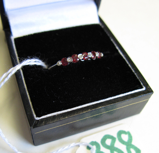 Appraisal: RUBY DIAMOND AND FOURTEEN KARAT WHITE GOLD RING set with