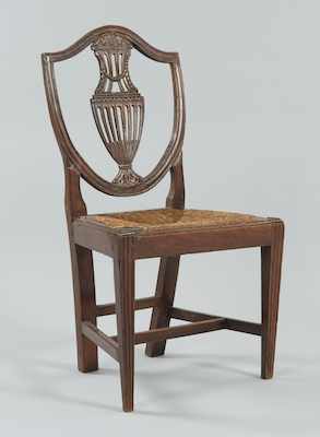 Appraisal: An Italian Made Hand Carved Shield Back Chair Dark brown