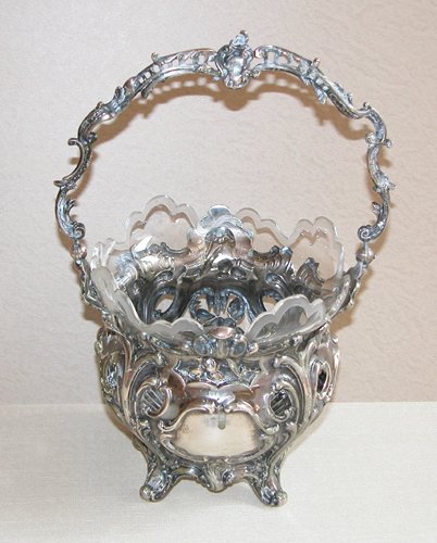 Appraisal: Artist Title French repousse silver basket with scroll style feet