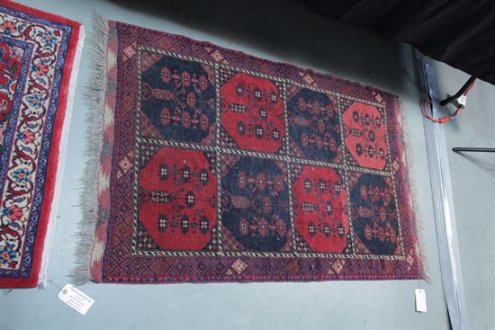 Appraisal: ORIENTAL THROW RUG Polychrome rug in shades of red tan